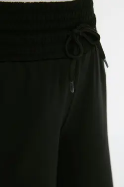 شلوار راحتی بافتنی دور کمر بلند پاچه گشاد کشی مشکی برند TRENDYOL MODEST کد 1649006588