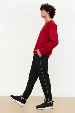 شلوار راحتی متناسب خط‎دار پاچه لاستیک مردانه مشکی برند TRENDYOL MAN کد 1651058625