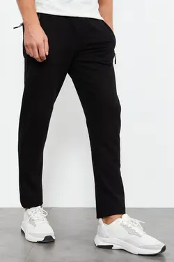 شلوار راحتی قالب جیب دار پاچه نوک کلاسیک استاندارد زیپدار مردانه مشکی برند Tommy Life کد 1652242987