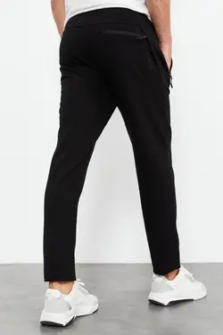 شلوار راحتی قالب جیب دار پاچه نوک کلاسیک استاندارد زیپدار مردانه مشکی برند Tommy Life کد 1652242987