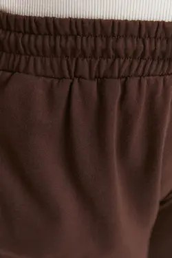 شلوار راحتی پاچه بافتنی جیب دار جاگر ساده طرح‎دار لاستیک قهوه‎ای برند Trendyol Curve کد 1661953298