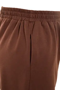 شلوار راحتی پاچه بافتنی جیب دار جاگر ساده طرح‎دار لاستیک قهوه‎ای برند Trendyol Curve کد 1661953298
