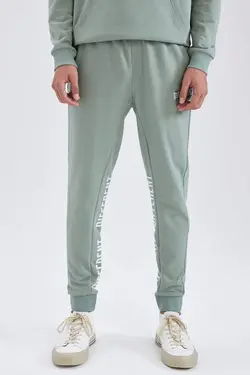 شلوار راحتی جاگر مردانه فیروزه ای دفاکتو