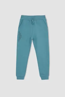 شلوار راحتی جاگر پسرانه فیروزه ای دفاکتو