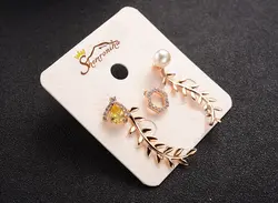 گوشواره نامتقارن سه تکه یونانی و مهره شش پر تمام کریستال اتریش گلد کد ۱۱۴۲۳