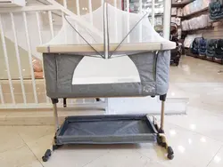 تخت کنار مادر گهواره شو انجل بیبی رنگ طوسی چرخدار  با تنظیم ارتفاع و توری پشه بند  Angel baby