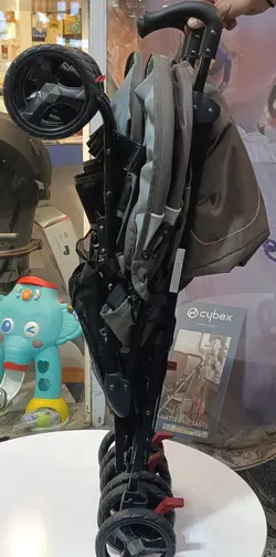 کالسکه دوقلو عصایی بغل هم رنگ طوسی خاکی بیبی کر با گارد محافظ جلو کالسکه  Baby Care Double Stroller