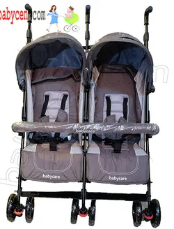 کالسکه دوقلو عصایی بغل هم رنگ طوسی خاکی بیبی کر با گارد محافظ جلو کالسکه  Baby Care Double Stroller
