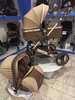کالسکه کریر انجل بیبی کریکات شونده با خواب کامل نوزادی و صندلی دوطرفه و نصب کریر بر روی کالسکه  رنگ کرم قهوه ای رزگلد با ساک لوازم و گرم کن پای کودک angel baby