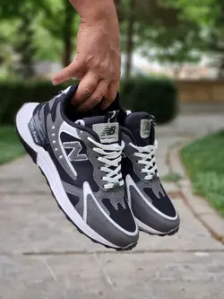 فروش ویژه کفش کتونی اسپرت مردانه مدل نیوبالانس فوق العاده جذاب و مدرن مشکی طوسی خط سفید