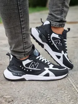 فروش ویژه این هفته کفش کتونی اسپرت مردانه پسرانه مدل نیوبالانس خاص وبروز و جذاب مشکی سفید