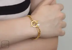 دستبند استیل کارتیر مروارید قفل تی