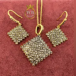 نیم ست استیل سیاه قلم طرح طلا - فروشگاه سیلور تی تی