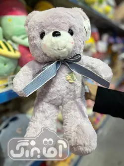 قیمت و خرید عروسک پولیشی خرس گل به سینه - سیسمونی آقابزرگ