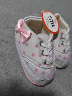 قیمت و خرید پاپوش نوزادی دخترانه تیتیل طرح خالخالی پاپیون - سیسمونی آقابزرگ