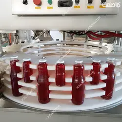 دستگاه دستگاه پرکن آب زرشک با درب بند اتوماتیک روتاری مخصوص بطری شیشه ای