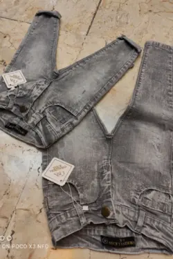 شلوار لی پر دورکش ساده طرح اسپرت طوسی رنگ - عمده فروشی لباس بچه‌گانه اکوبازار