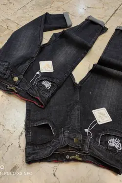 شلوار لی سوپرکش طرح اسپرت پارچه پر تک رنگ زغالی