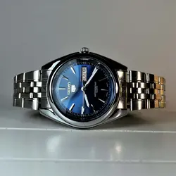 SEIKO 5 SK320 ساخت ژاپن سیکو موتور ژاپن &amp; کلا استیل ، با تقویم روزشمار وایام هفته لاتین با صفحه نفتی