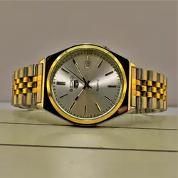 SEIKO 5 D6284 ساخت ژاپن سیکو موتور ژاپن دورنگ صفحه نقره ای ، فول استیل ، تقویم دار
