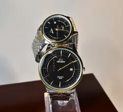 ORIENT WATCH موتور ژاپن (( موجود فقط مردانه ))  اورینت با موتور قدرتمند ژاپنی ** صفحه مشکی بند دورنگ با تقویم روز شمار ** درب استیل