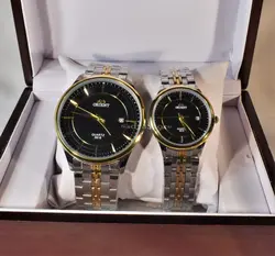 ORIENT WATCH موتور ژاپن (( موجود فقط مردانه ))  اورینت با موتور قدرتمند ژاپنی ** صفحه مشکی بند دورنگ با تقویم روز شمار ** درب استیل