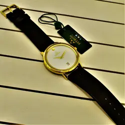 FITRON اورجینال ژاپن فیترون کلاسیک با صفحه ساده و تاریخ روز شمار * اصل ژاپن * بند مشکی باقاب طلایی صفحه سفید