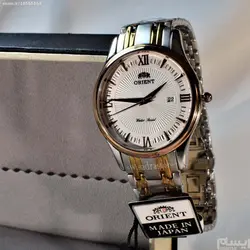 ORIENT WATCH SHMZ-CU-B20030 ساخت ژاپن اورینت ژاپن ** صفحه سفید صدفی فرز شده ،، بند دورنگ بهمراه تقویم روز شمار ** فول استیل