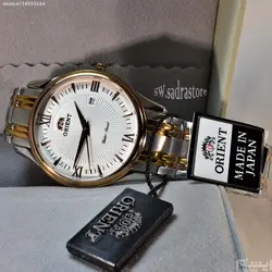 ORIENT WATCH SHMZ-CU-B20030 ساخت ژاپن اورینت ژاپن ** صفحه سفید صدفی فرز شده ،، بند دورنگ بهمراه تقویم روز شمار ** فول استیل