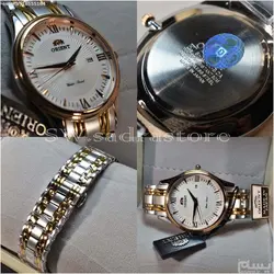 ORIENT WATCH SHMZ-CU-B20030 ساخت ژاپن اورینت ژاپن ** صفحه سفید صدفی فرز شده ،، بند دورنگ بهمراه تقویم روز شمار ** فول استیل