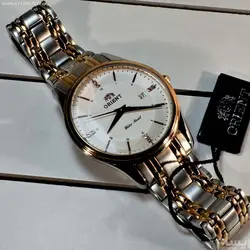 ORIENT WATCH SHM2-CO-BCA ساخت ژاپن اورینت ژاپن ** صفحه سفید صدفی فرز شده ،، بند دورنگ بهمراه تقویم روز شمار ** فول استیل