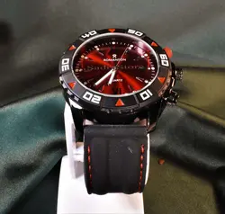 ROMANSON WATCH رومانسون تک موتوره نگین دار با صفحه زرشکی براق ** شیشه شفاف بندژله ای دور دوخت با صفحه ای ساده