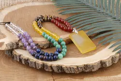 گردنبند هفت چاکرا و مدال عقیق زرد با حکاکی دعای شرف الشمس