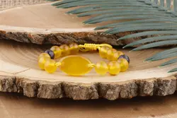 دستبند عقیق زرد و آمیتیست و میانکار عقیق زرد با حکاکی شرف الشمس