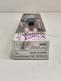 عروسک باربی با لباس پولک دار