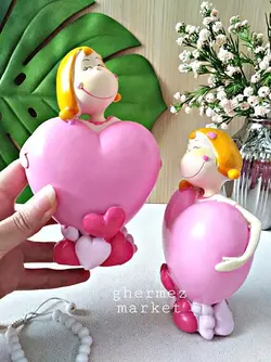 قلک و مجسمه دختر قلبی