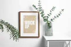 موکاپ موکاپ قاب چوبی روی دیوار سفید با اکالیپتوس تازه در گلدان