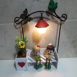 مجسمه چراغ دار دختر و پسر عاشق روی نیمکت