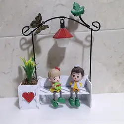 مجسمه چراغ دار دختر و پسر عاشق روی نیمکت