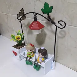 مجسمه چراغ دار دختر و پسر عاشق روی نیمکت