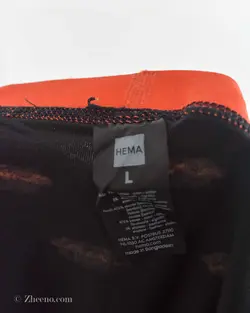 شورت مشکی و نارنجی طرح‌دار HEMA