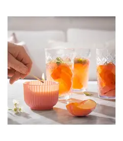 شمع معطر آیکیا، مدل SOCKERLÖNN، صورتی، 20 ساعته، هلو و شکوفه