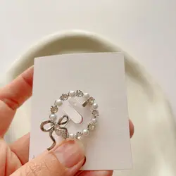 گل سینه حلقه و پاپیون