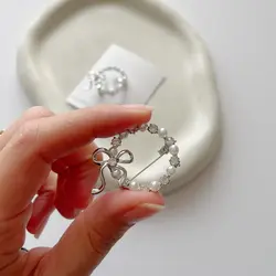 گل سینه حلقه و پاپیون