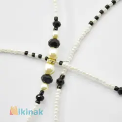 بند عینک شامل منجوق سفید و مشکی