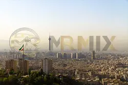 عکس استوک خط افق شهر تهران با پرچم ایران و برج میلاد