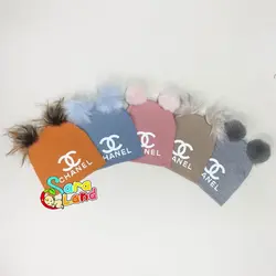 کلاه نوزاد پوم پوم رنگی طرح Chanel - سیسمونی سارالند