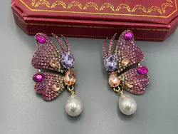 گوشواره نگین کاری پروانه صورتی &bull; گالری بدلیجات ترنج