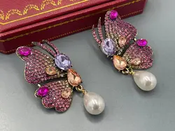 گوشواره نگین کاری پروانه صورتی &bull; گالری بدلیجات ترنج