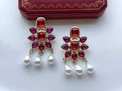 گوشواره خورشید با کریستال قرمز &bull; گالری بدلیجات ترنج